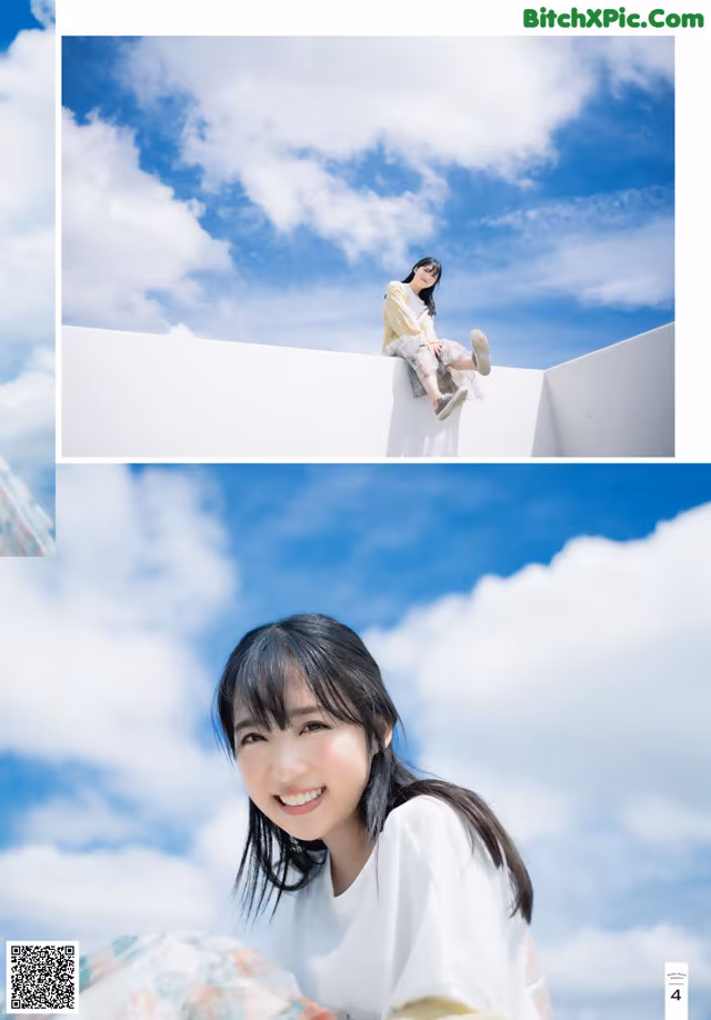 A woman sitting on top of a white wall.