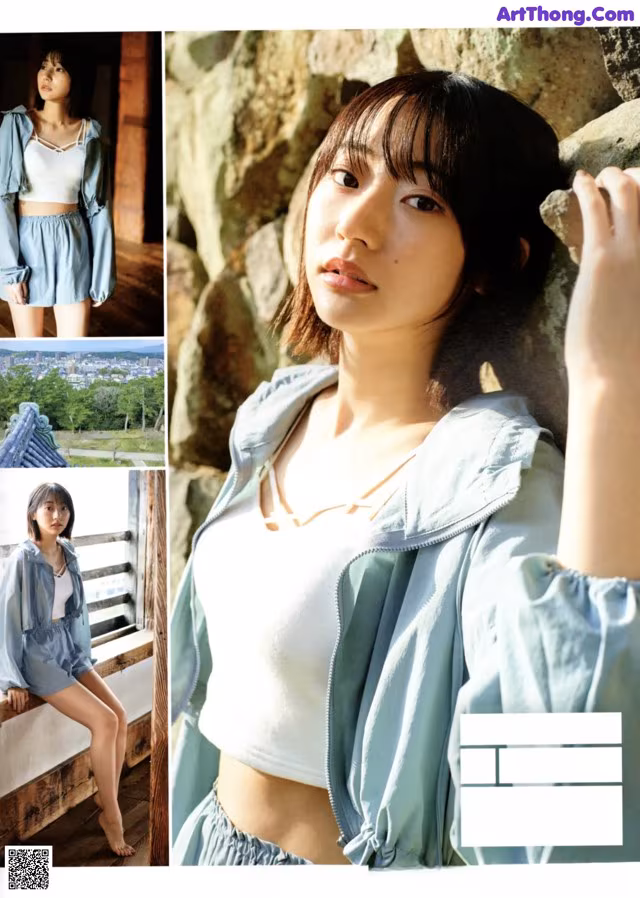 A woman in a white top and blue jacket posing for a magazine.